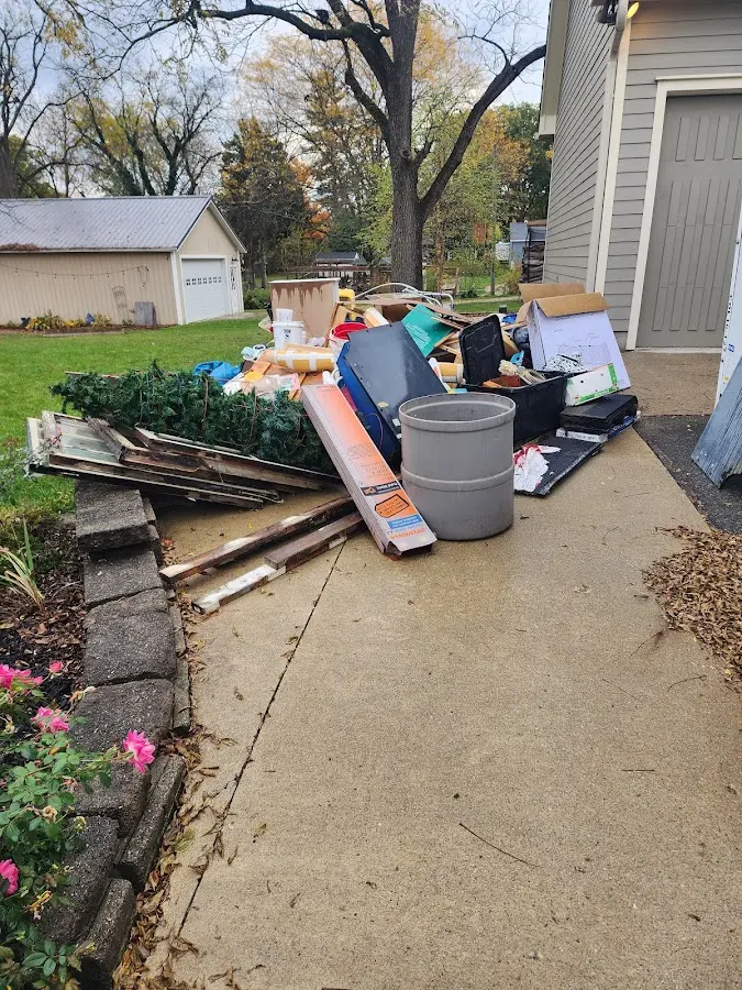 Dumpster being loaded with debris for 3 Yard Dumpster Rental in Iola